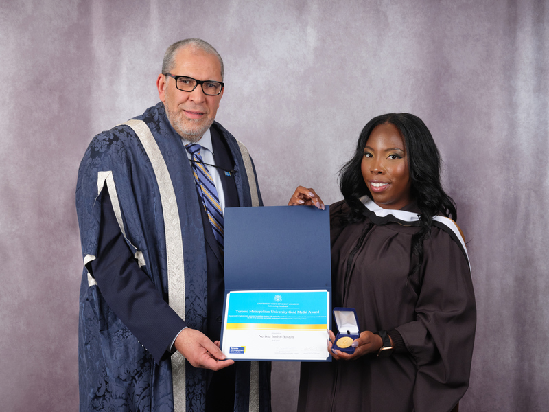 Nerissa Inniss-Boston and Mohamed Lachemi jointly hold an award certificate and gold medal